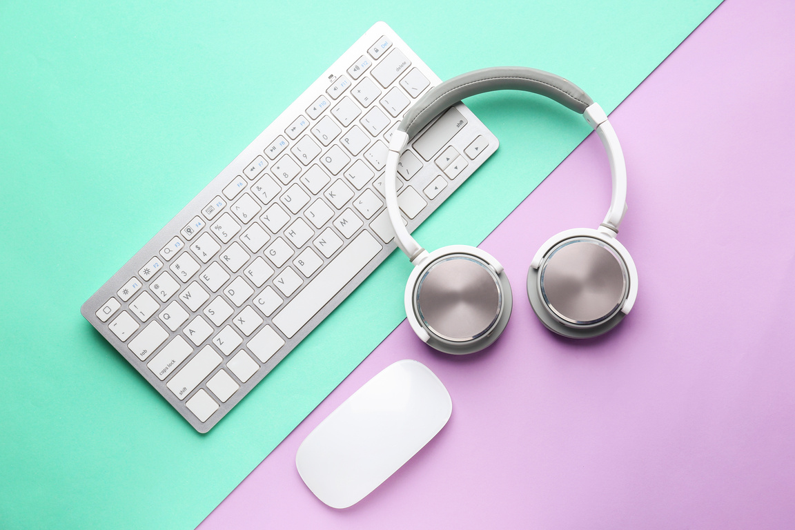 PC Keyboard, Mouse and Headphones on Color Background